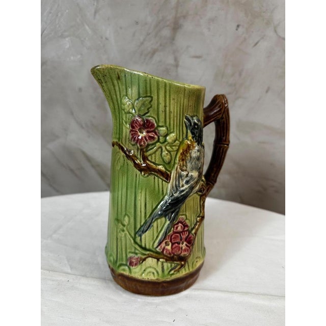 An elegant earthenware pitcher dating from the early 20th century, in the Art Nouveau period, manufactured by the Onnaing...