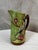 An elegant earthenware pitcher dating from the early 20th century, in the Art Nouveau period, manufactured by the Onnaing...