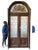 ANTIQUE LEADED GLASS ARCHED DOUBLE ENTRY DOORS WITH STAINED GLASS CREST PANEL FROM PALM BEACH ESTATE A striking pair of...