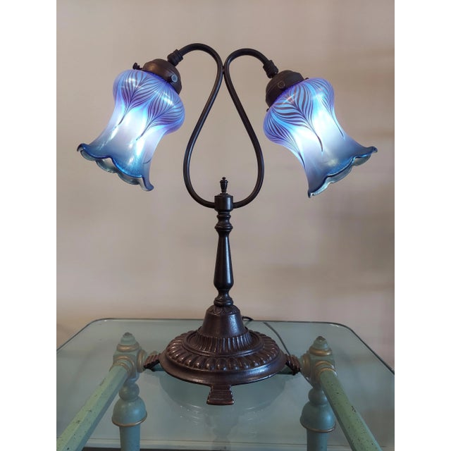 Signed on the bottom New Begining. The quezel shades are not signed and are in near mint condition. 19" h. The base...