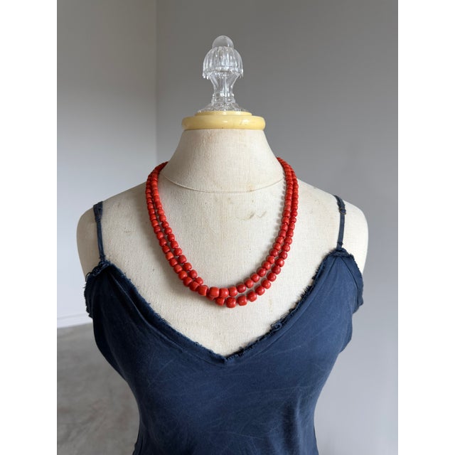 Two nearly identical natural red coral necklaces. A genuine pair with hand-knotted construction, circa 1970s. The perfect...