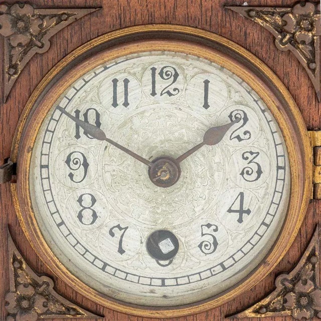 Black Forest Lenzkirch Oak Wood Mantle Clock, circa 1893, with domed top and applied gilt metal floral and rams head...