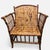 Authentic vintage bamboo lounge armchair crafted from real bamboo with an architectural arched back, open spindle sides,...