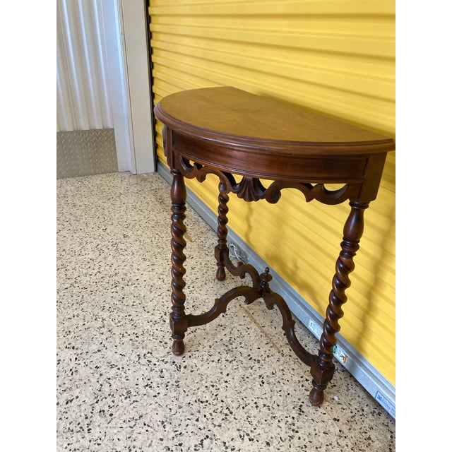 A lovely antique demi-lune hall table dating approximately from the late 19th to early 20th century. Featuring beautifully...