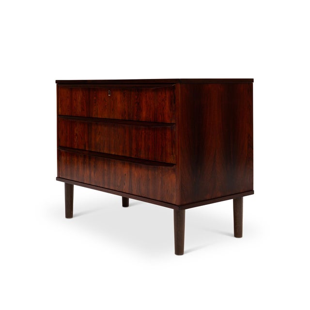 This stunning Danish mid-century rosewood dresser from the 1960s epitomizes timeless design. Its exquisite rosewood-grain...
