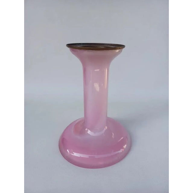 Candlestick By Hanne Dreutler For Studio Ahus, Sweden 1982. In opalescent pink glass and brass candles support. It is...