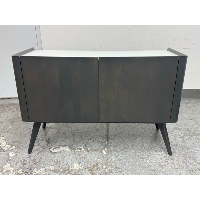 Design Plus Gallery presents the Downtown Buffet from Canadel. This contemporary two-door buffet pairs mid-century...