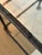 Exceptional matched pair of authentic Claudio Reyes hand-forged iron and glass side tables. Beautifully textured forged...