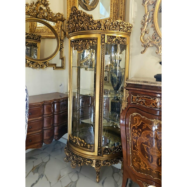 Make a statement with this exquisite French Rococo-style display cabinet, designed to showcase your most treasured pieces...
