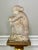Lovely antique weathered solid cement garden statue of a woman in a thoughtful pose, circa 1890-1910. She displays the...