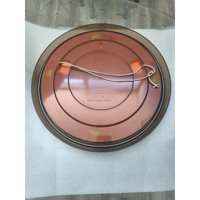 Beautiful vintage mirror by Gilac. France, 1970s. Space Age design. Smoky transparent Plexiglas frame. The glass has a...