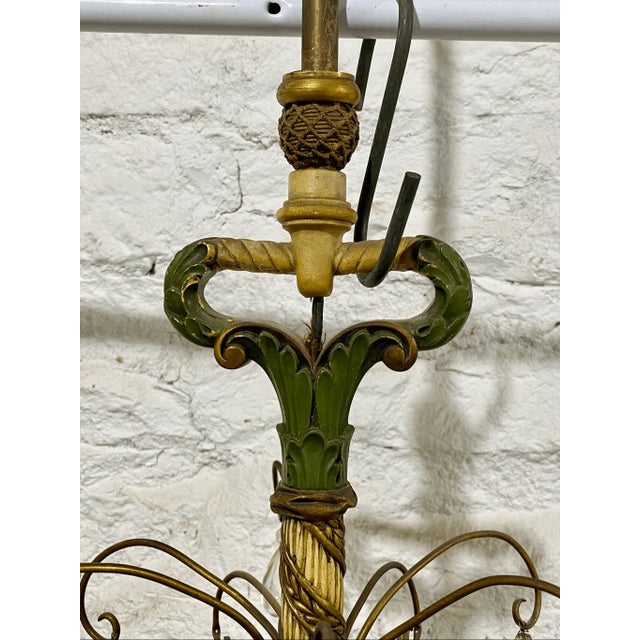 19” across 25” tall Good condition Discover the artistry of this antique chandelier, reminiscent of the flowing lines and...