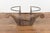 A rustic Indonesian coffee table base made of antique wooden fragment and accented with iron supports. Steeped in rustic...