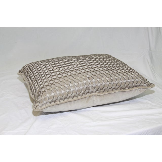 Pretty pillow covered in a layered lattice decorative fabric on the front and a pretty taupe velvet on the back.
