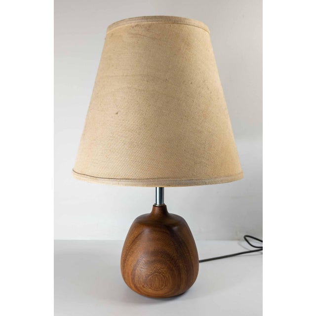 We are selling this cute little petite carved teak wood boudoir table lamp. This small lamp has great form and is probably...