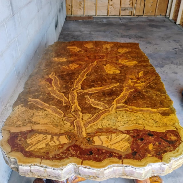 Elevate your dining experience with this exquisite driftwood table and chair set. The agate top adds a luxurious touch,...