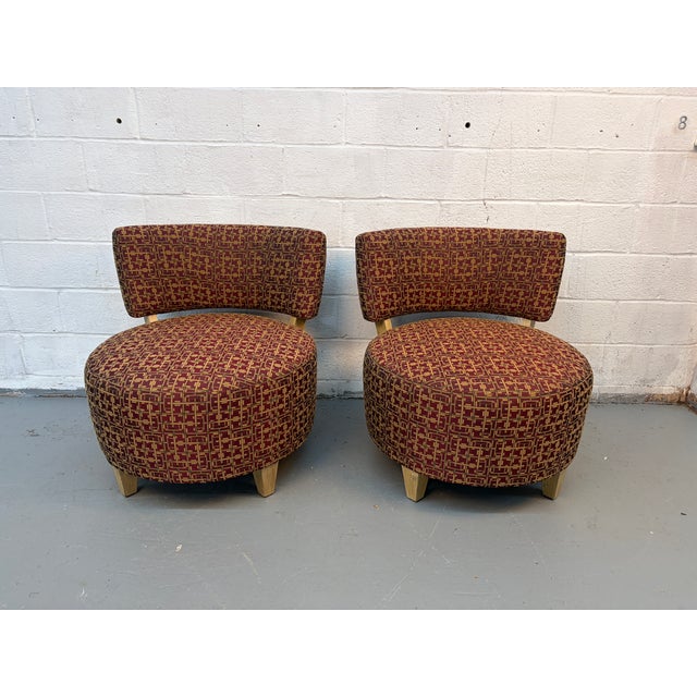 Stylish and versatile pair of round accent chairs, perfect for adding warmth and character to any living space. These...