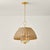 Arwen offers a playful twist on a classic half-dome chandelier. The candle array is shaded in natural rattan wicker,...