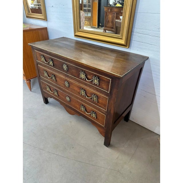 18th Century French Louis XVI Commode from South France. featuring fine walnut, the wood has been finished with a French...
