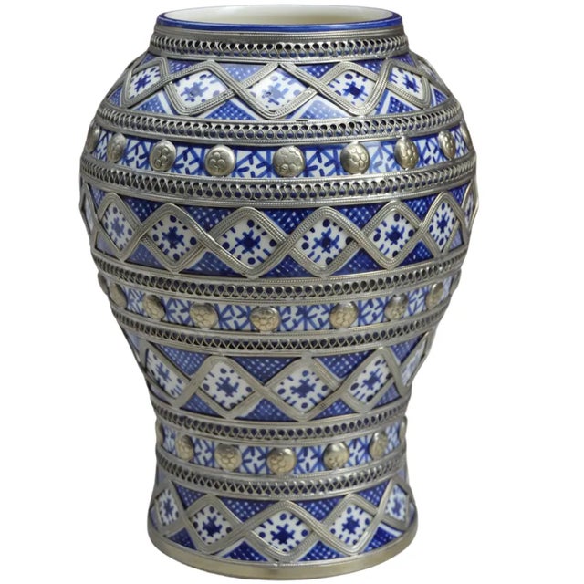Handcrafted and glazed ceramic vase with lid. Featuring an intricate hand-painted Moorish pattern in blue and white with...
