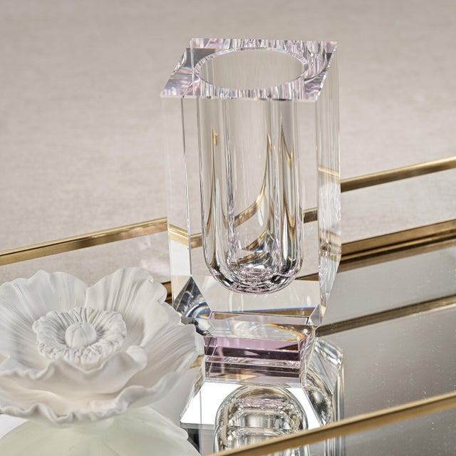 This crystal bud vase was cut to reveal gleaming facets. A colored base casts a warm glow through the crystal. Center hole...