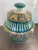 Beautiful 11” tall Moroccan tureen in vibrant green, blue and orange hand painted glaze. No chips or cracks. Width is 7”.