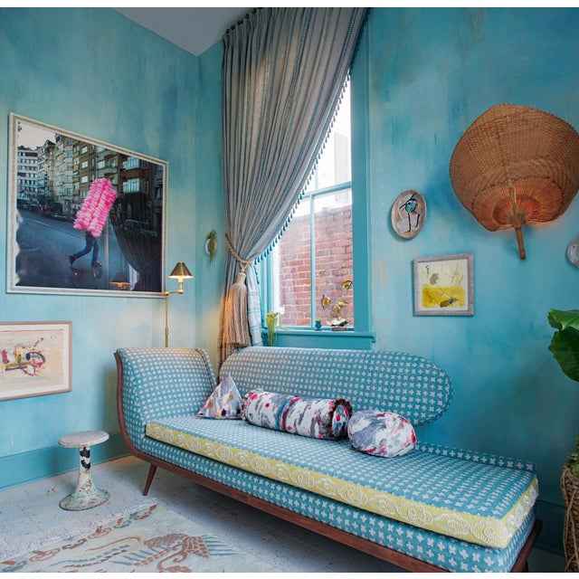 Midcentury chaise lounge reupholstered in Bastideaux's Bogo Lagoon fabric, with a walnut base.