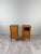 An elegant pair of small chests of drawers with a warm, luminous patina. Each piece features five drawers on the front,...