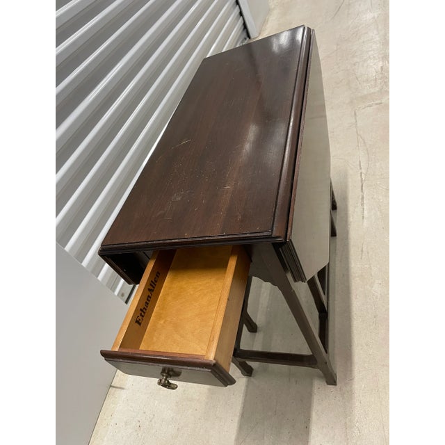 Vintage Ethan Allen drop-leaf table circa 1980s. Can be utilized as an end or side table as well as an entry table.