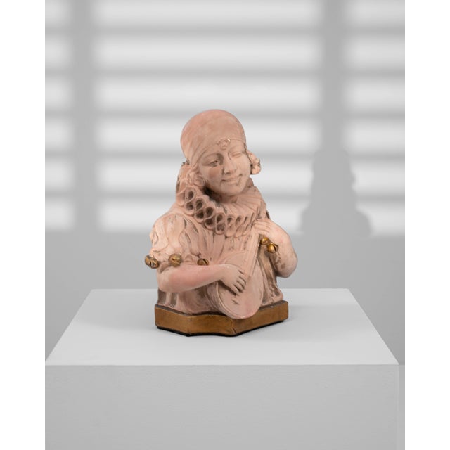 20th Century French Terracotta Bust depicting a serenading figure holding a lute. This finely modeled sculpture captures a...
