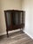 Vintage early-mid 20th Queen Anne-style mahogany china cabinet with a rich dark wood finish and graceful cabriole legs....