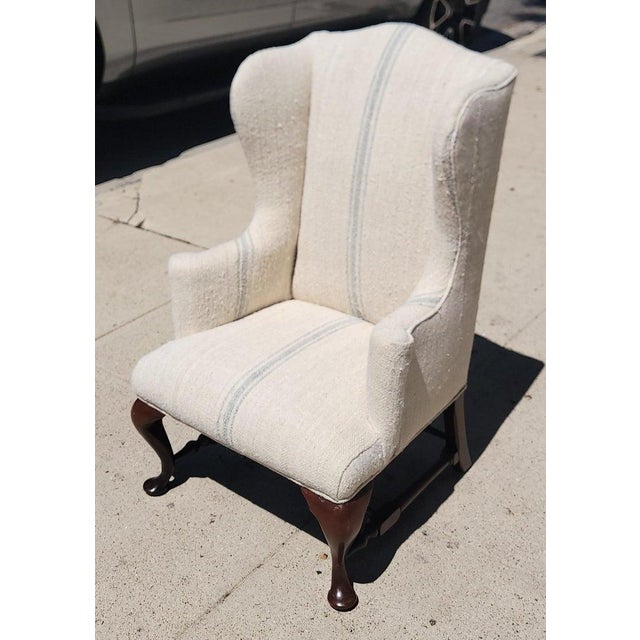 Early 20thc Child's Wing-back Chair and Ottoman With 19thc Linen Upholstery. The Entire chair is upholstered with a...