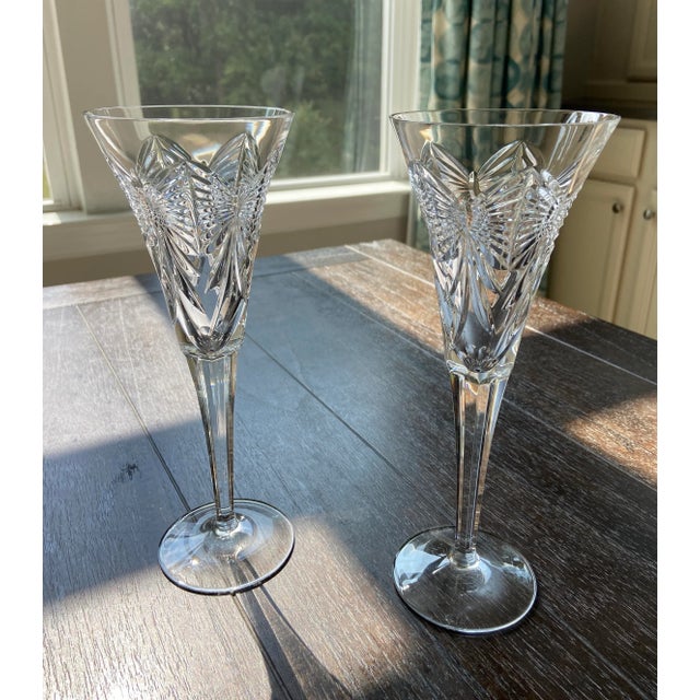 This elegant pair of Waterford crystal champagne flutes is from the Millennium Series that has been discontinued. The...