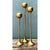 Strikingly sleek and architectural, this set of three vintage brass candle holders exhibits an elongated, minimalist...