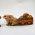 These figurines showcase realistically sculpted brown rabbits in a low, forward stance, as if pulling a load. Each rabbit...