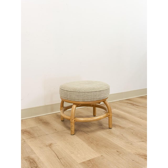 This lovely vintage MCM rattan ottoman and stool is a warm and practical coastal accent seating find. The rich honey...