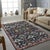 This blue wool rug features a hand knotted pile construction and originates from artisan weavers in India. It represents a...