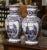 Decorate a shelf or console table with this elegant pair of antique Delft vases. Crafted in Holland circa 1920, both urns...
