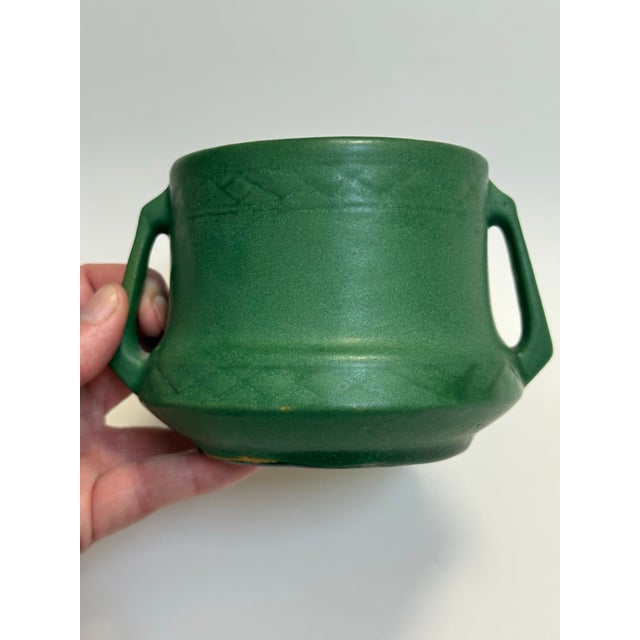 Early Weller Arts & Crafts pottery vessel (use it how you like) in the iconic matte green glaze. This softly glittering...