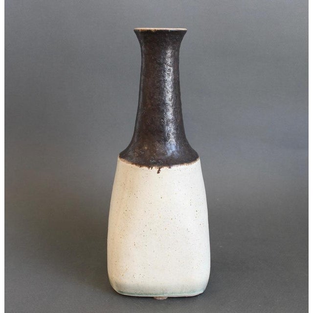 Ceramic italian decorative vase by bruno gambone (circa 1980s). A sensuous bottle-shaped piece featuring an oatmeal-hued,...