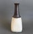 Ceramic italian decorative vase by bruno gambone (circa 1980s). A sensuous bottle-shaped piece featuring an oatmeal-hued,...