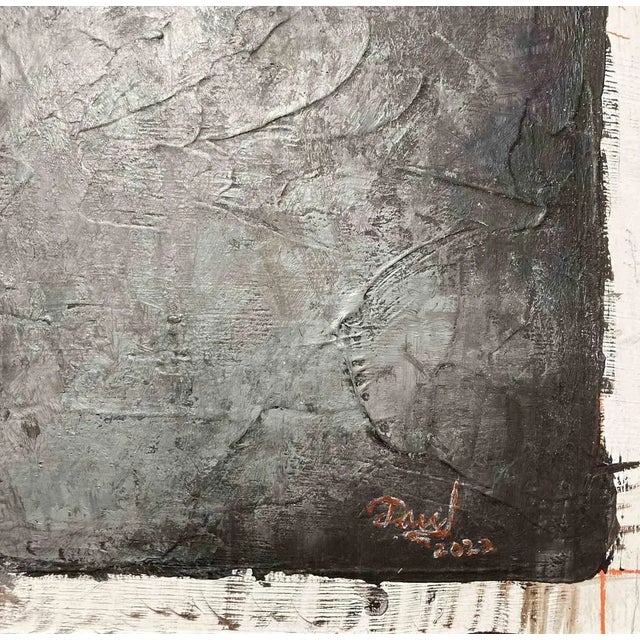 "in this painting two heads, one blue and one red are facing each other. In the middle between the heads a black...