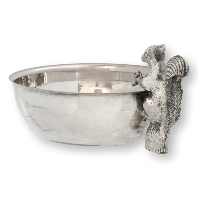 A charming midcentury English silverplate trinket dish featuring a wonderfully detailed squirrel perched on a tree stump...