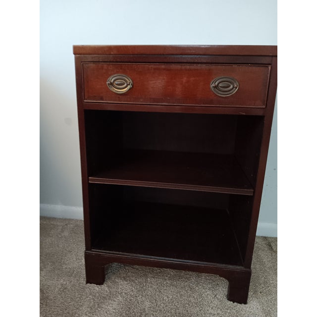 A wonderful vintage--almost antique--solid mahogany nightable by famed American furniture company Kittinger. Fashioned in...