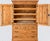 A handsome 19th-century English pine linen press, combining generous storage with beautifully restrained country-house...
