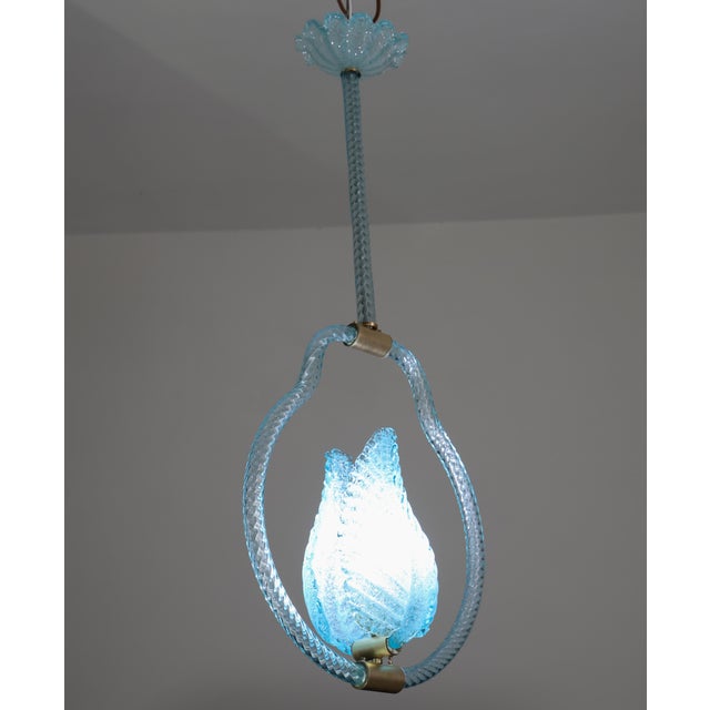 Stunning Murano chandelier by artist Ercole Barovier in rare blu color. The pendant consists of 6 glass elements and a...