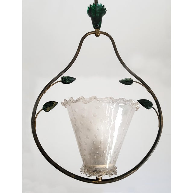 A graceful, floral mid-century Muranoglass and brass chandelier in the style of Barovier & Toso, with an elegantly curved...