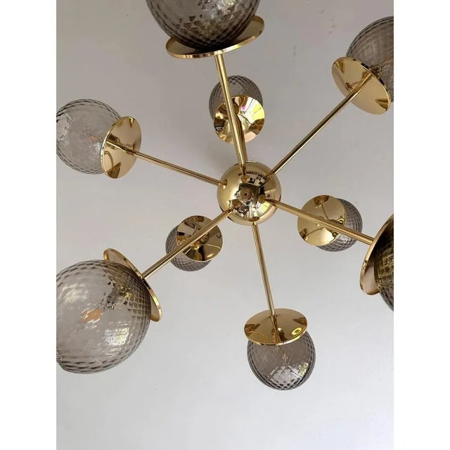 Luxury sputnik chandelier with smoked fumè spheres in Murano glass ."ballotton" is a traditional working of Murano glass....