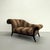 A dramatic and sculptural Thayer Coggin settee featuring exaggerated rolled scroll arms, a softly contoured silhouette,...