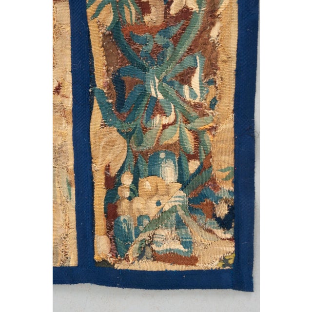 This vibrant tapestry fragment comes from 18th century France. Two panels have been recently attached with brilliant blue...